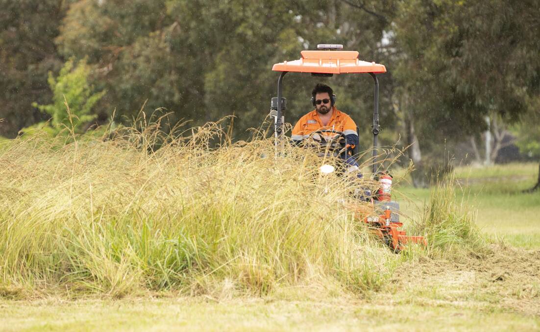 A "rapid response" mowing team has been brought on by the ACT government this spring. Picture by Keegan Carroll