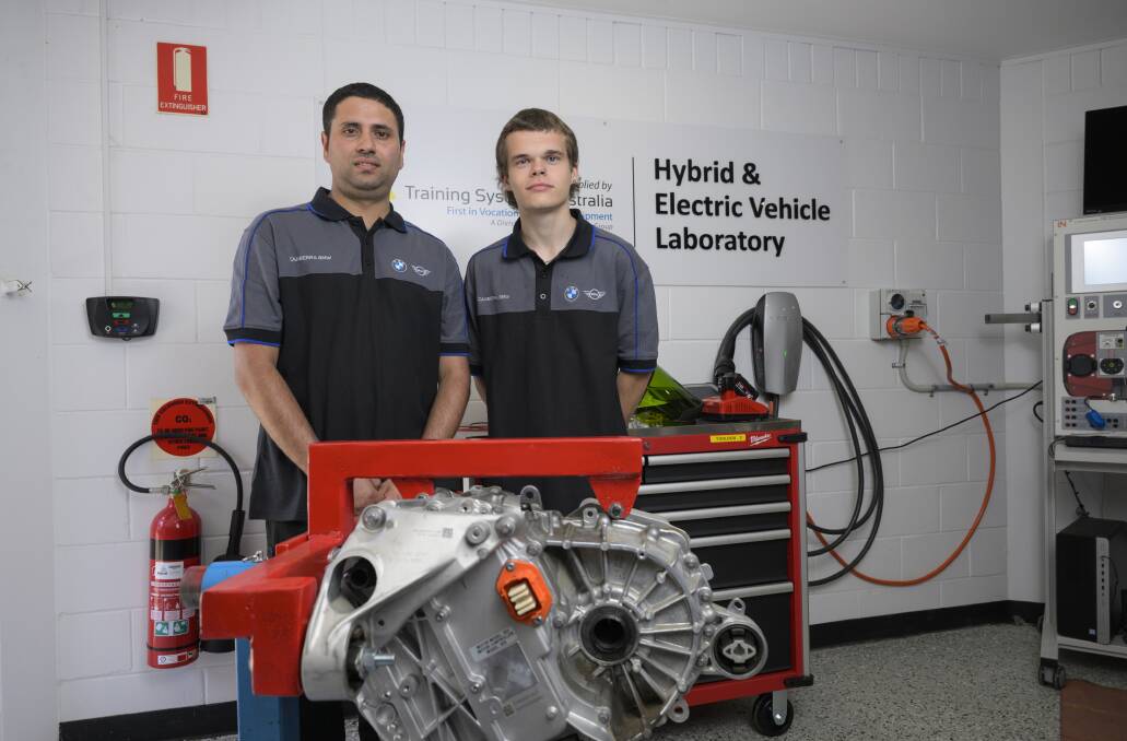 First year CIT Students Suraj Ghimire and Hugo McMeil are learning the new skill of electric mechanics to help the growing rise of Electric cars. Picture by Keegan Carroll