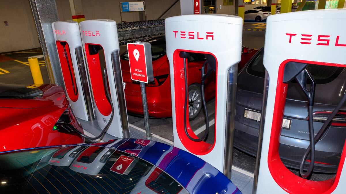 Tesla line up to recharge in Tuggeranong. Picture by Sitthixay Ditthavong 