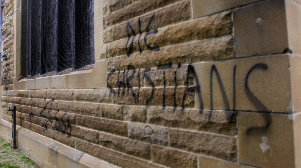 Offensive graffiti on a church in Ainslie. Picture by Graham Tidy