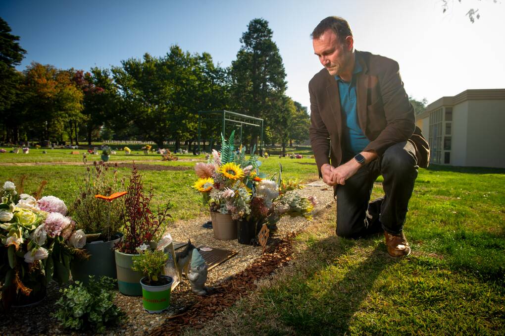 Tom McLuckie at his son Matt's grave. Picture by Elesa Kurtz 