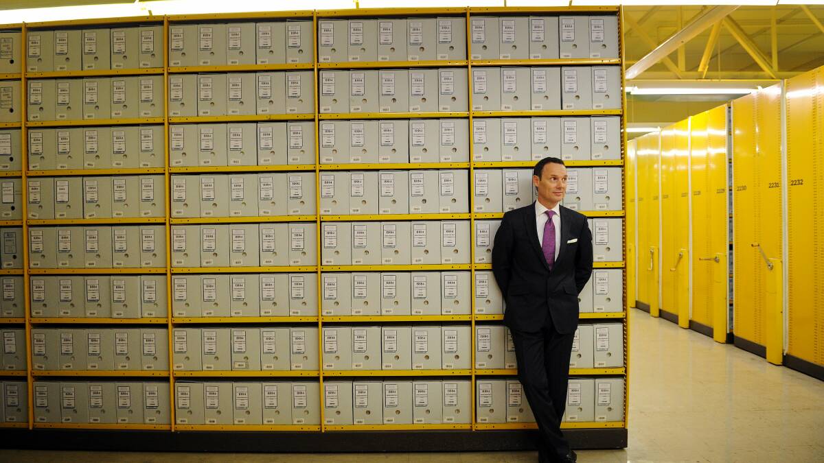 National Archives director-general David Fricker stands amongst the boxes in 2012. Photo: Colleen Petch