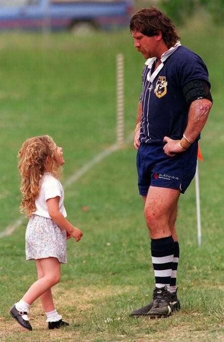 Renee Didier helped escort her father, Geoff, off the sidelines during a Canberra Royals match in 1997.