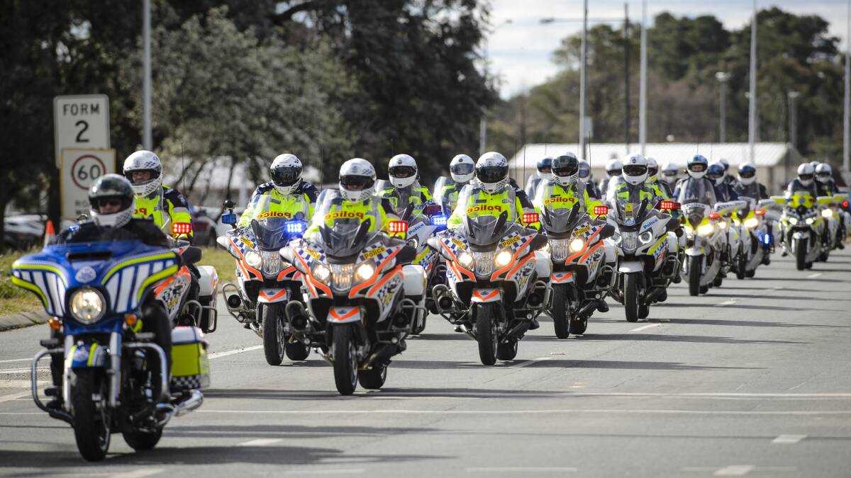 A long convoy of motorbikes makes its way down Northbourne Avenue during the 2017 Wall to Wall Ride for Remembrance. Picture: Sitthixay Ditthavong