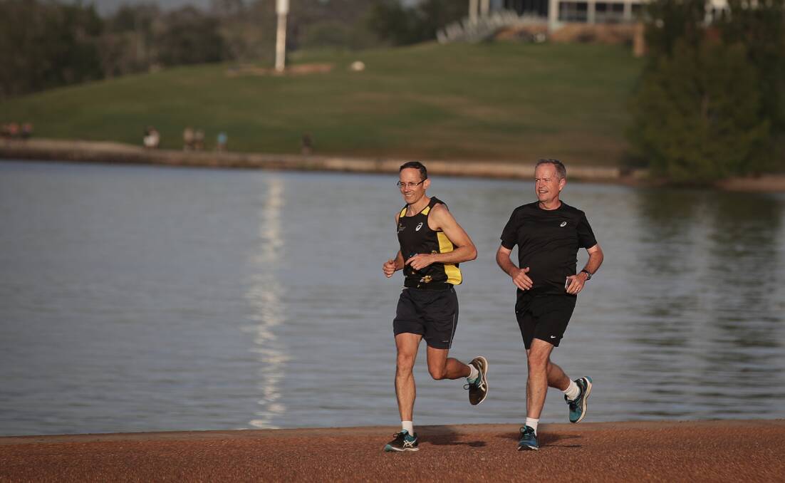 Andrew Leigh running with Bill Shorten last year. Picture: Alex Ellinghausen