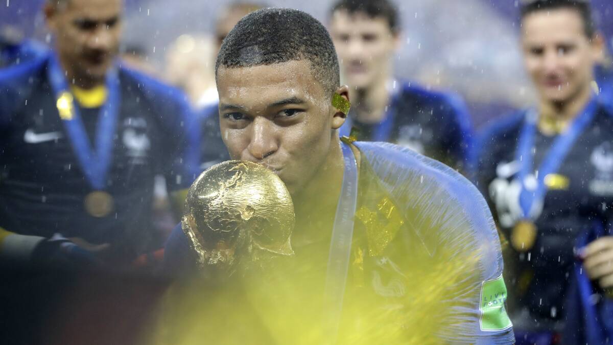 Kylian Mbappe kisses the World Cup trophy after France's 2018 win in Russia. Picture: AP