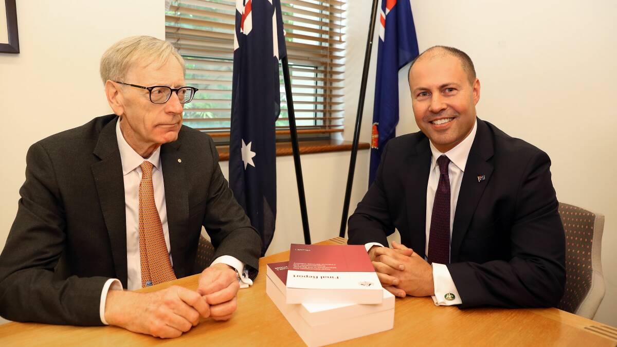 Commissioner Kenneth Hayne and Treasurer Josh Frydenberg (right) are seen with the final report from the banking royal commission. Photo: AAP