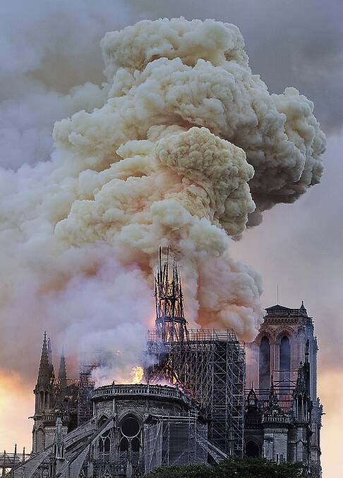 Flames and smoke rise as the spire on Notre Dame cathedral collapses in Paris. Photo: Diana Ayanna/AP