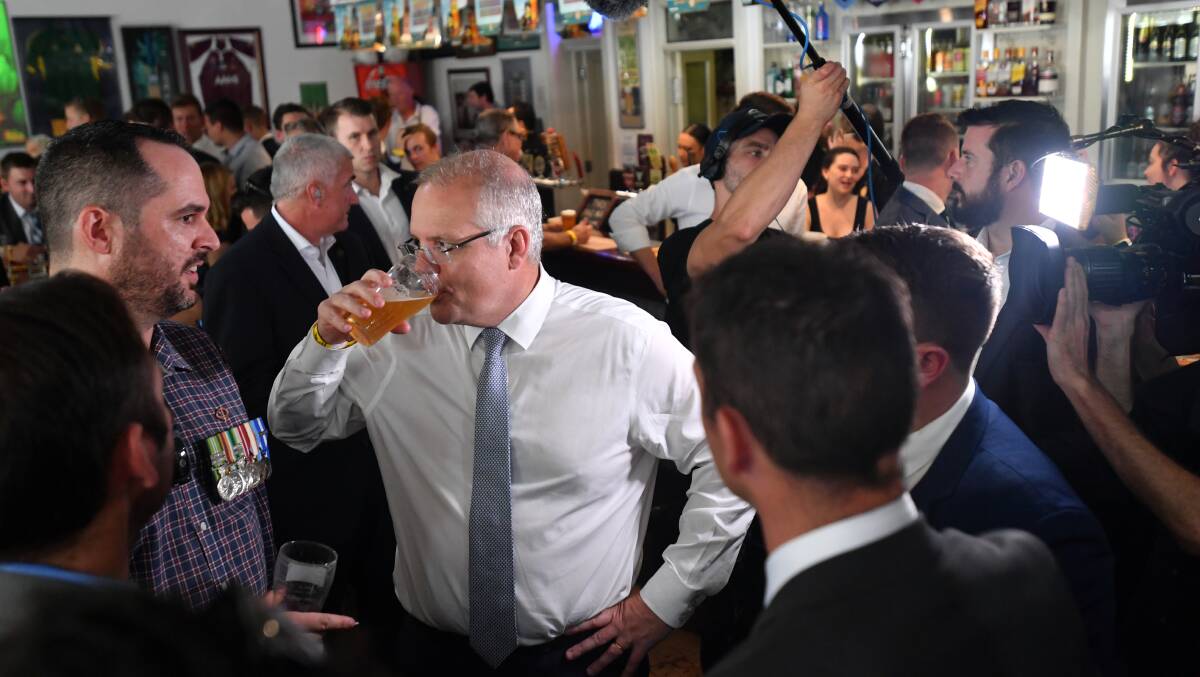 Prime Minister Scott Morrison, who announced new money for apprentices on Thursday, also stopped by the Australian Hotel in Townsville. Photo: AAP/Mick Tsikas