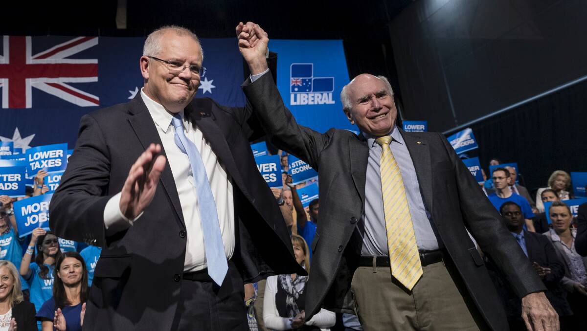 Former Prime Minister John Howard and Scott Morrison at a Liberal Party rally in Sydney on Sunday. Photo: Brook Mitchell
