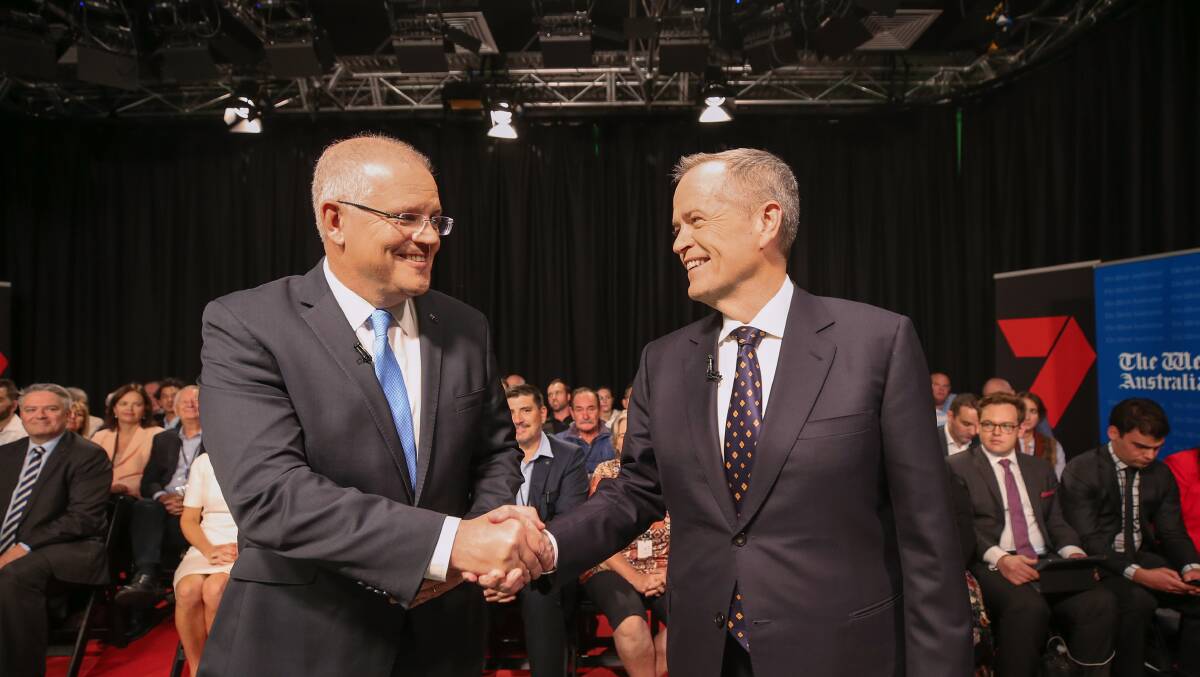 Prime Minister Scott Morrison and Opposition Leader Bill Shorten shake hands before the first leaders forum in Perth. Photo: AAP Image/Nic Ellis