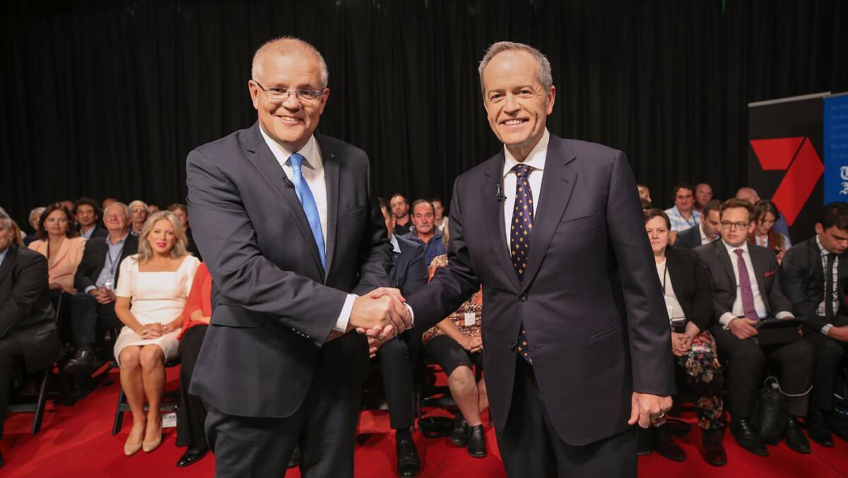 Scott Morrison and Bill Shorten ... a world of difference, but the world hardly rates a mention in this campaign. Photo: AAP