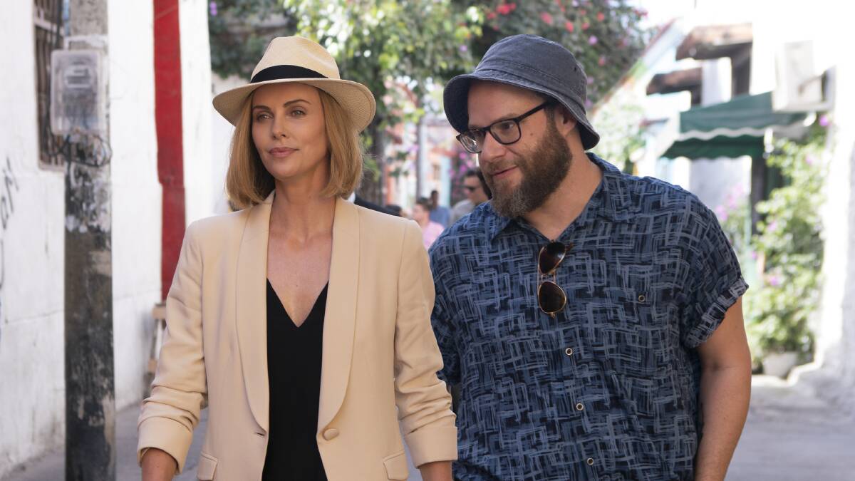  Charlize Theron, left, and Seth Rogen in a scene from Long Shot. Picture: Hector Alvarez