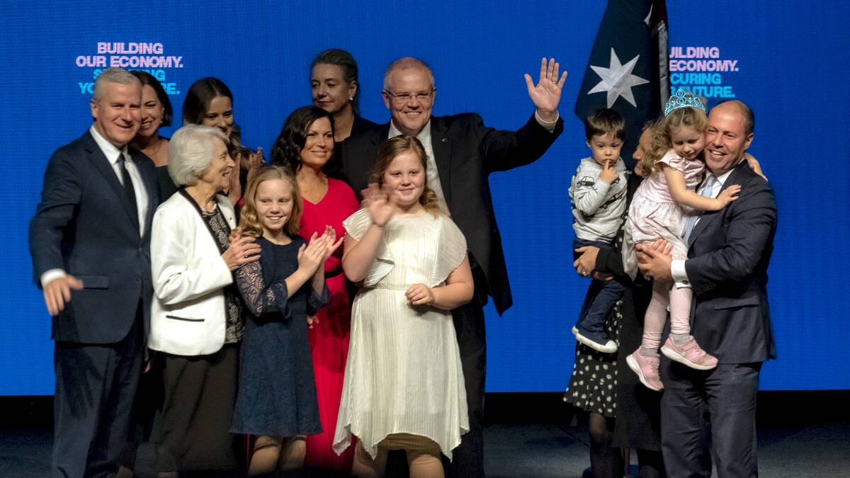 Prime Minister Scott Morrison and Treasurer Josh Frydenburg are joined on stage with their families at the Coalition campaign launch in Melbourne on Sunday. Picture: Luis Enrique Ascui