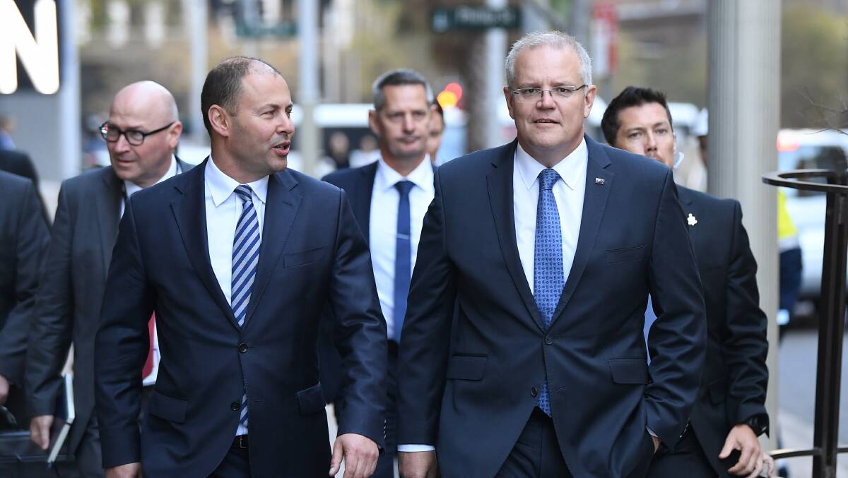 Prime Minister Scott Morrison (right) and Treasurer Josh Frydenberg arrive for a meeting with RBA governor Philip Lowe in Sydney on Wednesday. Picture: AAP Image/Joel Carrett