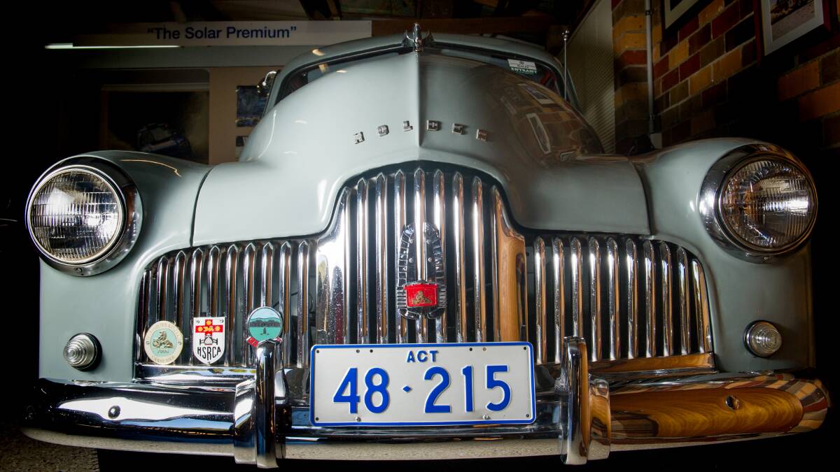A 1948 Holden FX sedan, with the perfect ACT number plate for its vintage and rare club badges. Picture: Elesa Kurtz