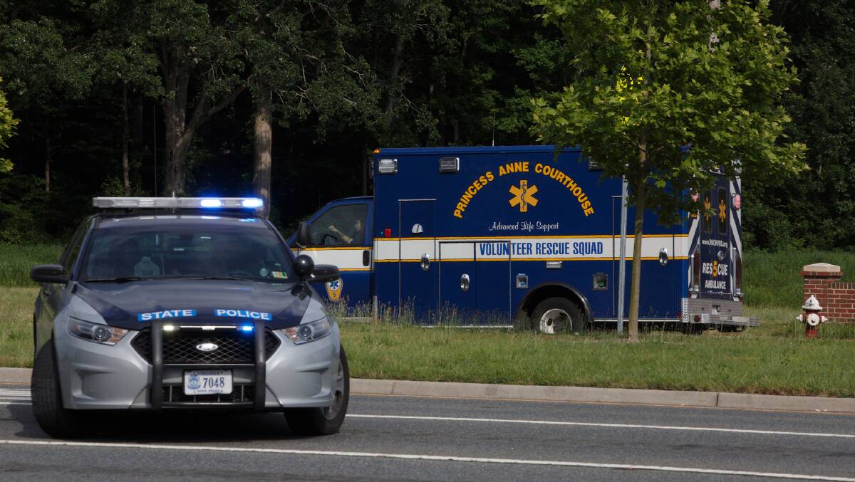 An ambulance turns on Nimmo Parkway following a shooting at the Virginia Beach Municipal Centre on Friday. Picture: AP