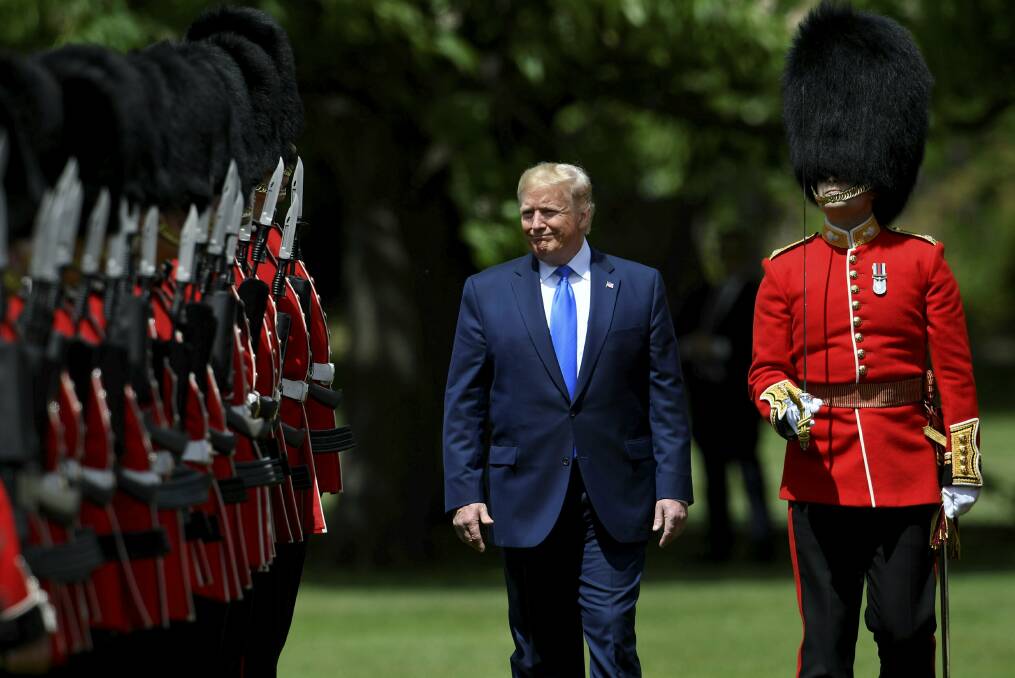 U.S. President Donald Trump inspects an honour guard during a welcome ceremony in the garden of Buckingham Palace. Picture: AP