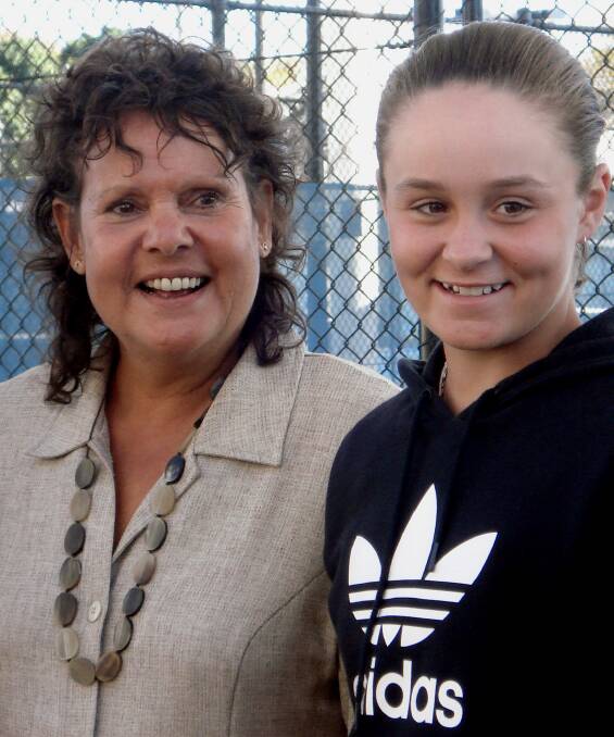 Ashleigh Barty, then the winner of the Wimbledon girls' singles title, with her idol and tennis great Evonne Goolagong Cawley in 2011. Picture: AAP