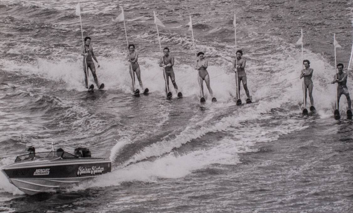 The Victorian water ski association perform a manoeuvre in Lake Burley Griffin. 1984.