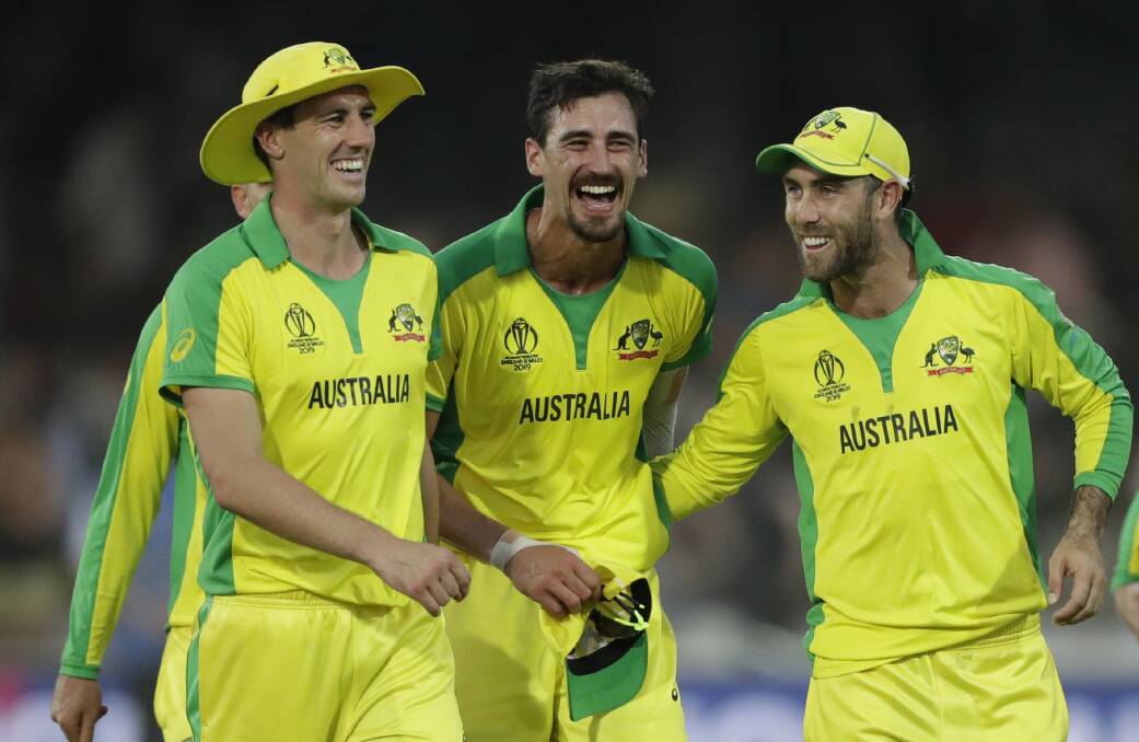 Australia's Mitchell Starc, centre, celebrates after Australia defeated New Zealand by 86 runs during the Cricket World Cup match in London. Picture: AAP