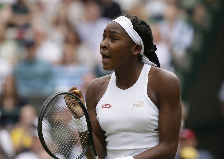Cori "Coco" Gauff reacts after winning the first set against Venus Williams on day one at Wimbledon. Picture: AP