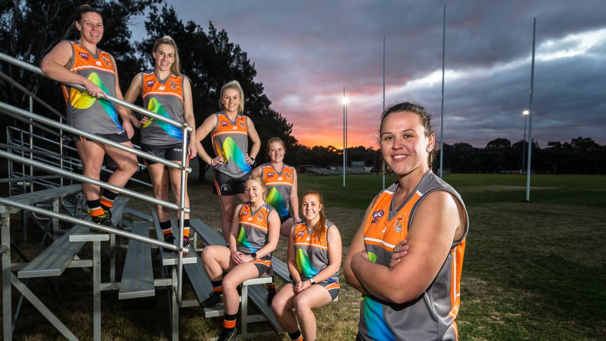 The humble surrounds of Stirling Oval will be home to so much more on Saturday, when Molonglo wear jerseys shown by Lisa Lark, Emma Darman, Phoebe Highfield, Beth Williams, Steph Henneberger, Maddie Dwyer and Gabby Summerville. Picture: Elesa Kurtz