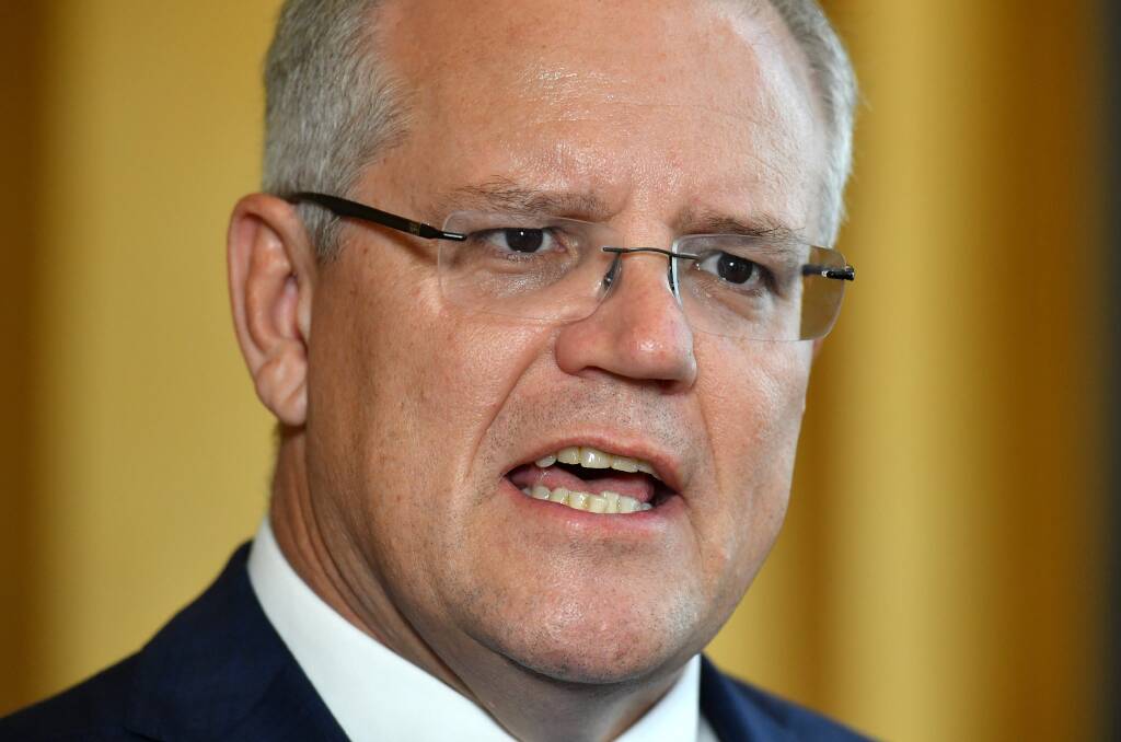 Prime Minister Scott Morrison has weighed in on signs outside toilets in his department. Picture: AAP Image