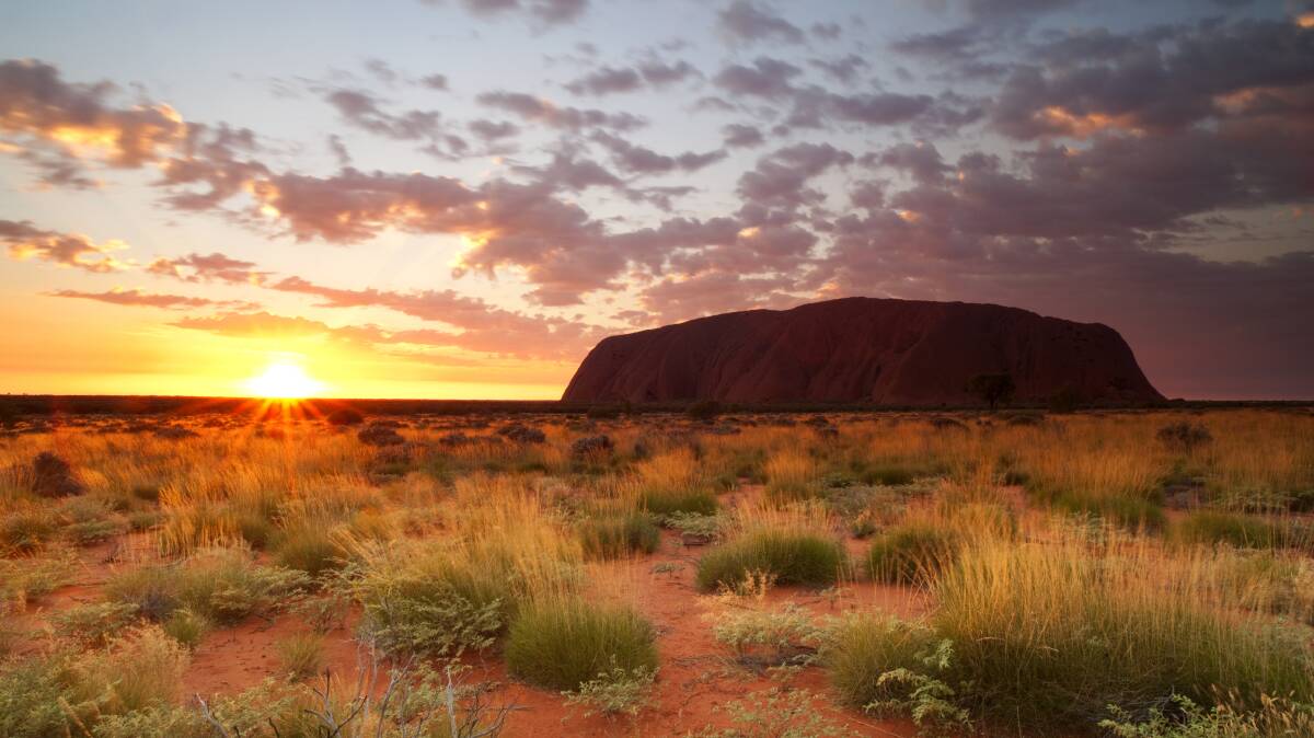 Dawn over Uluru. The rock belongs to all Australians a reader says.
