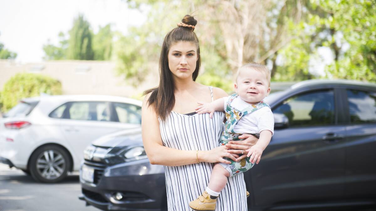 Tayla Morris, with her 7-month-old son Wyatt Bush at Kidsafe ACT childcare. Parents have been urged to not leave their kids in the car as the weather heats up. Picture: Dion Georgopoulos