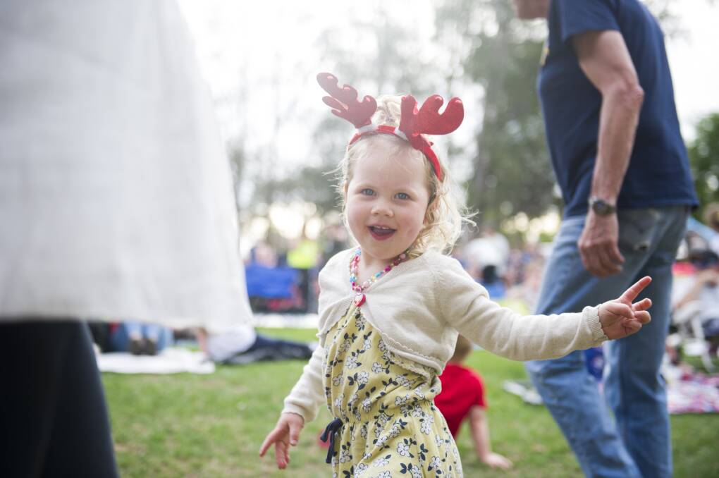 Rebecca Sweett, 2, dancing to the music at Carols by Candlelight at Stage 88. Picture: Dion Georgopoulos