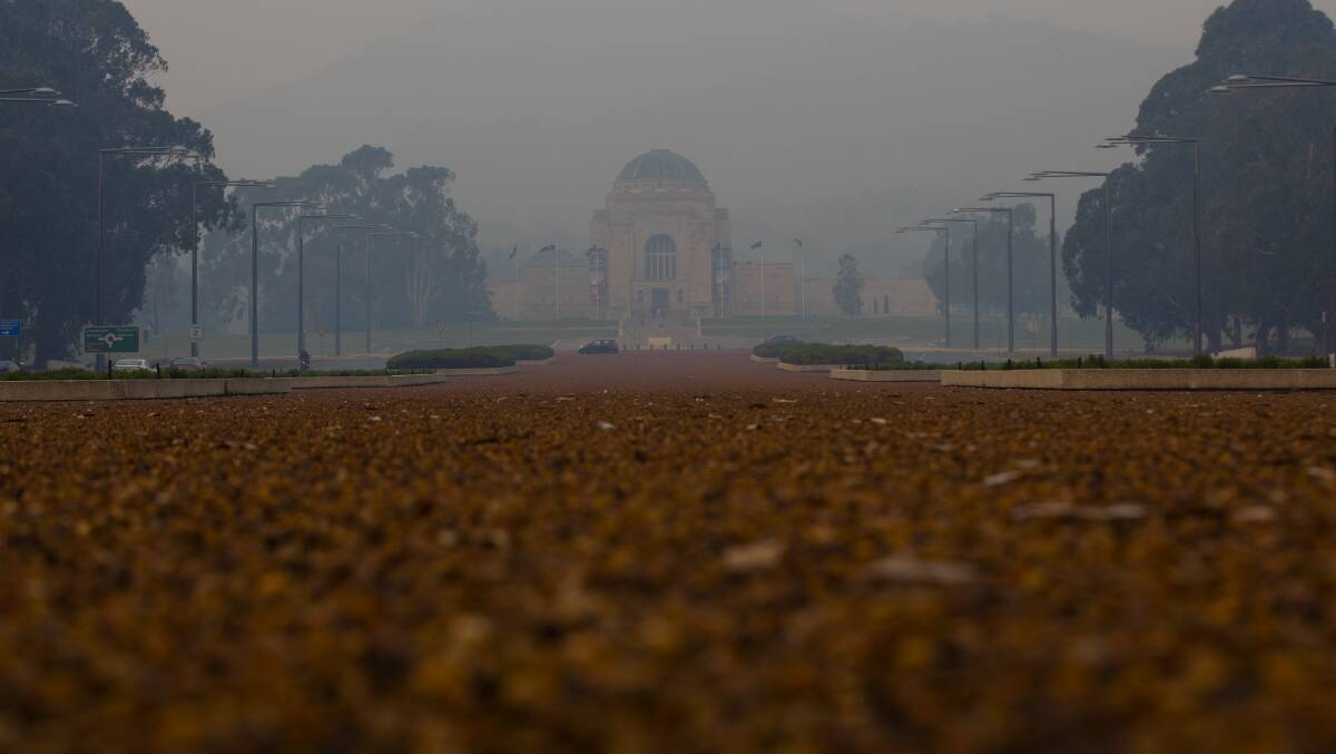 Smoke shrouds the Australian War Memorial on Tuesday. Picture: Jamila Toderas