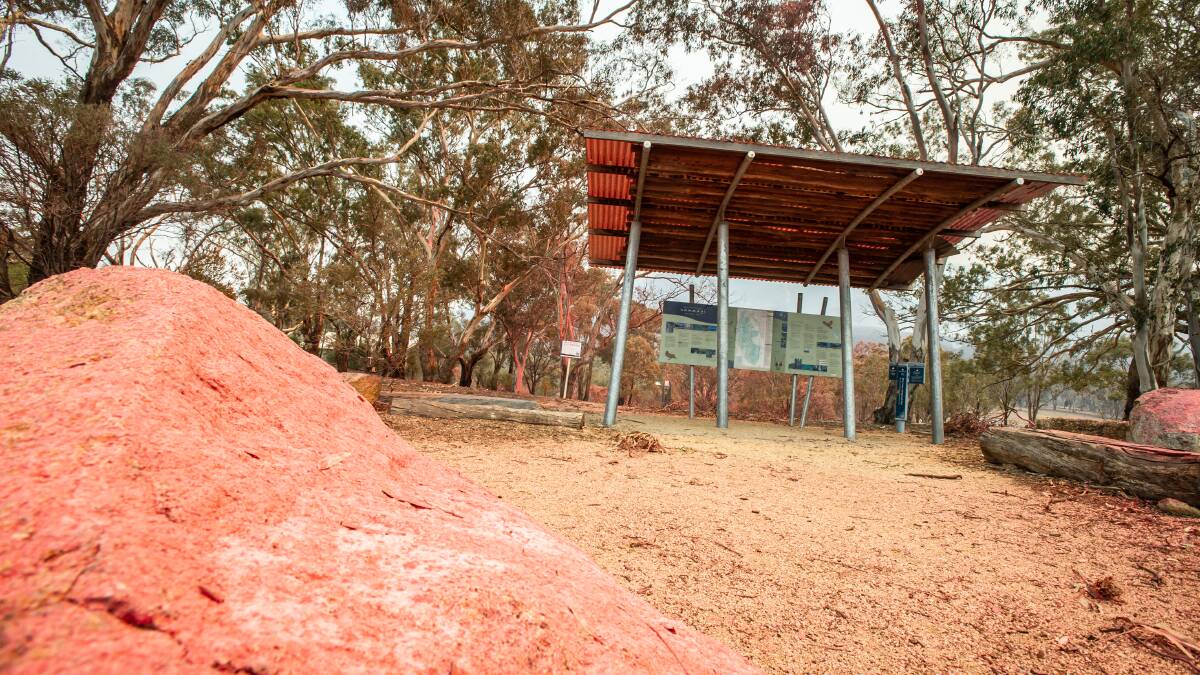 Fire retardant dropped onto the Namadgi Visitor Centre to protect from advancing flames. Picture: Karleen Minney