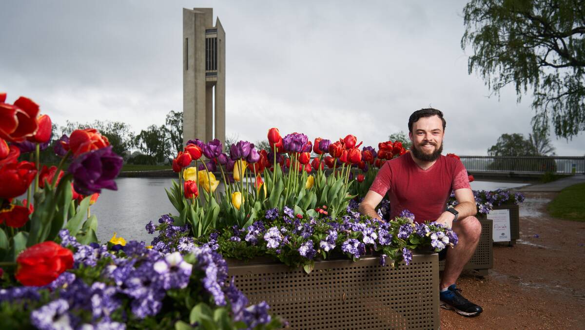 Alden Christley-Balcomb from Turner with a Floriade Reimagined installation in front of the Carillon. Picture: Matt Loxton
