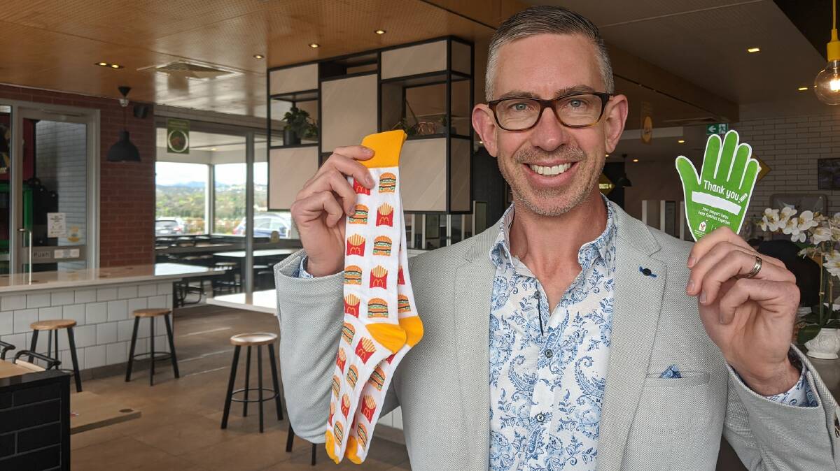 Brad Carroll, owner of the forthcoming McDonald's, promoting McHappy Day at his Molonglo store. Picture supplied
