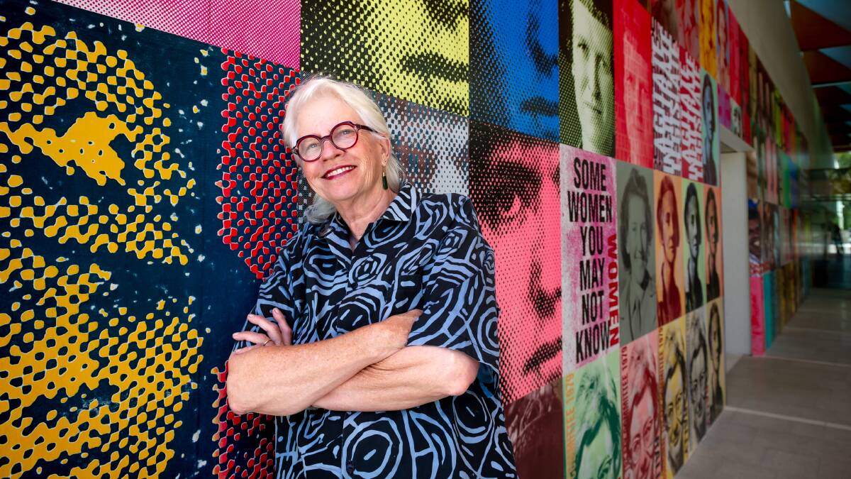 Alison Alder with her work on the National Portrait Gallery forecourt wall. Picture by Elesa Kurtz