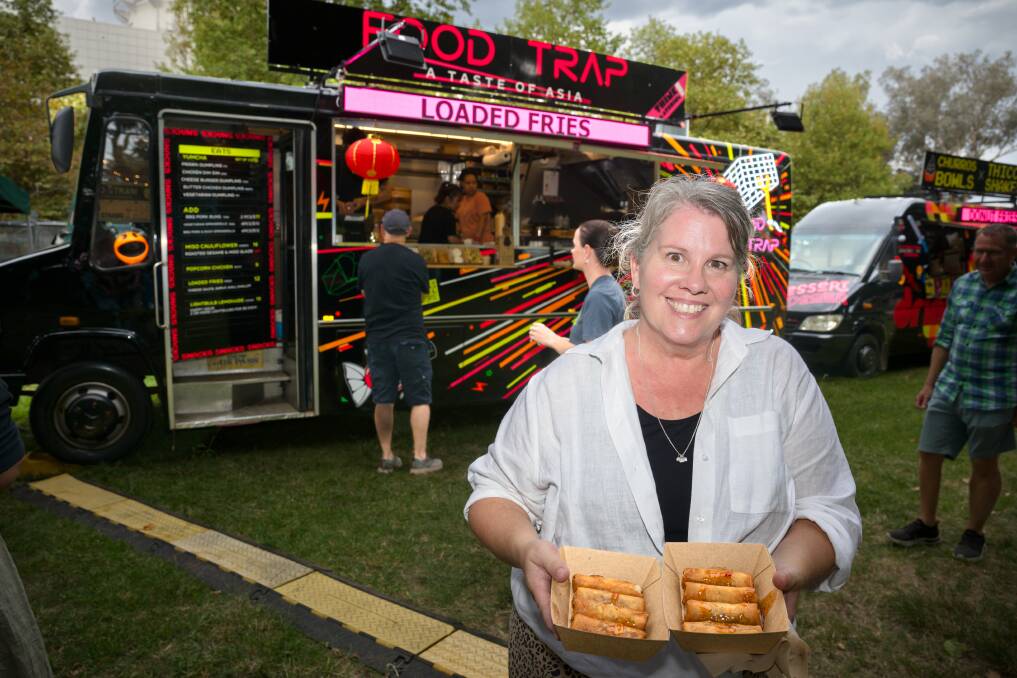 Jenni Copland, from Goulburn, with some spring rolls from Food Trap. Picture by Sitthixay Ditthavong