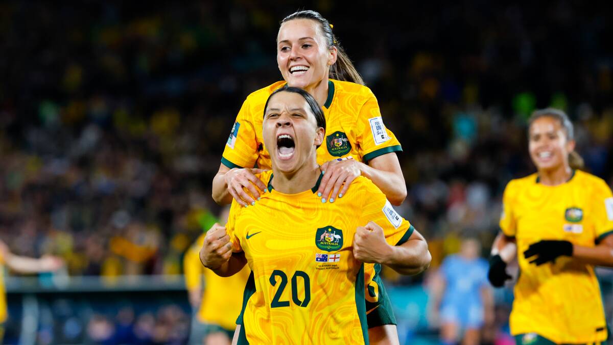 Matildas captain Sam Kerr celebrates with Hayley Raso after scoring a goal during the game against England. Picture by Anna Warr
