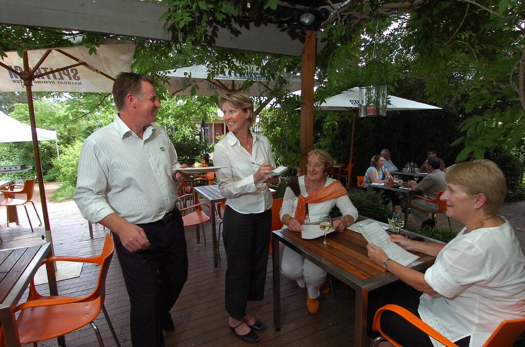 Andrew Haskins and wife Catherine serve customers at Pod Food in 2007. Picture by Holly Curtis