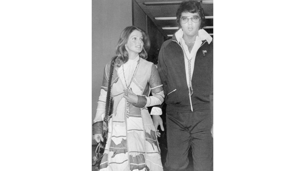 Priscilla and Elvis Presley leaving the Santa Monica California Superior Court in 1973. Priscilla's outfit was recreated for the biopic. Picture Getty Images