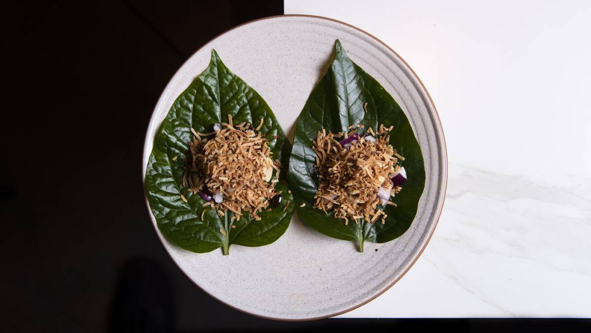 Betel leaf with roasted coconuts, peanut, ginger, lime, onion, galangal and shrimp reduction. Picture: Keegan Carroll