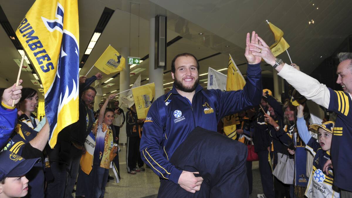 Ben Alexander celebrates with fans at Canberra Airport before the 2013 Super Rugby final. The year was one of the best, but also the toughest, of his life. Picture by Melissa Adams