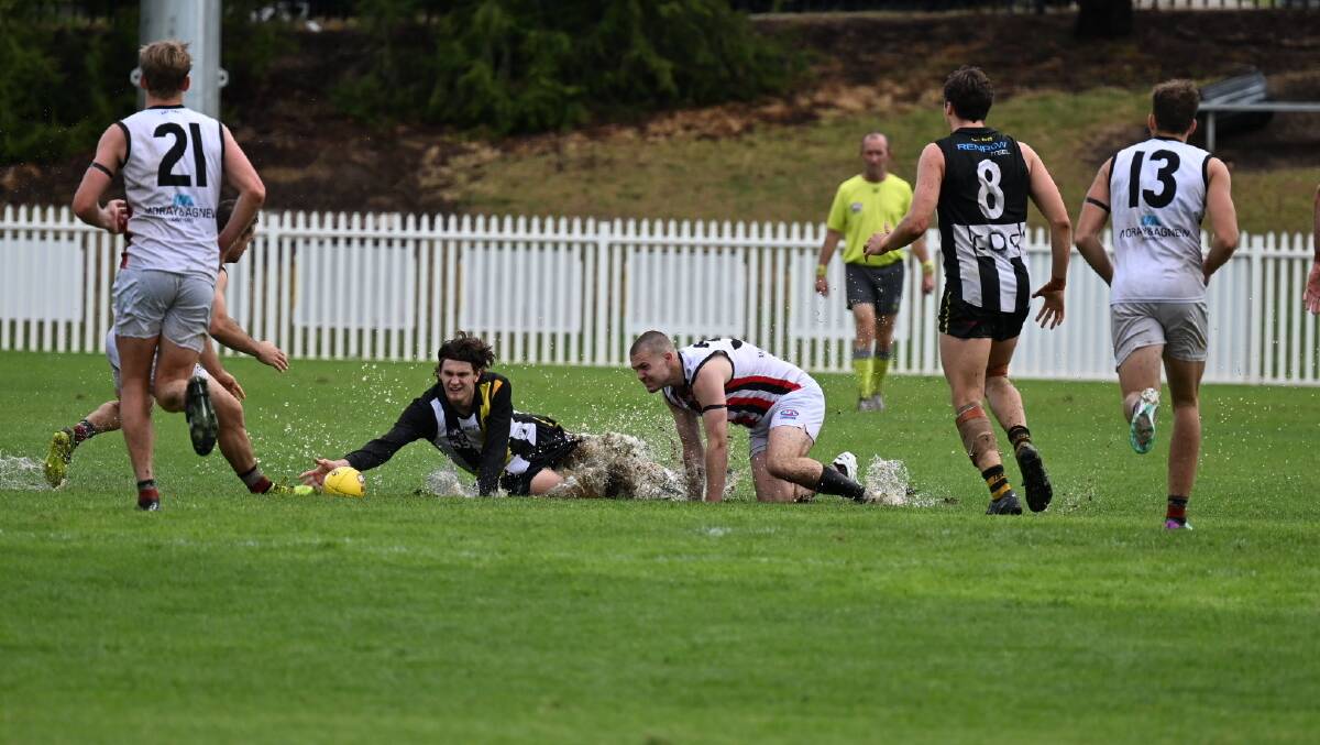 The Queanbeyan Tigers and Ainslie played in the wet on Saturday. Picture by Elesa Kurtz