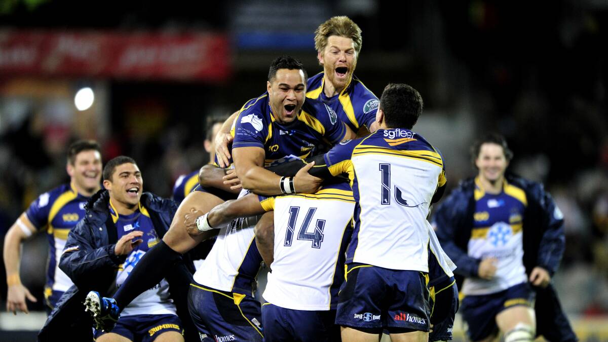 The Brumbies celebrate beating the British and Irish Lions in 2013. Picture by Melissa Adams