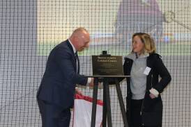 Cricket ACT chair Greg Boorer and Ellyse Perry unveil a new cricket centre at Radford College. Picture supplied by Cricket ACT
