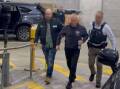 Australian Federal Police officers after arresting 62-year-old Igor Korolev on espionage charges. Picture AFP