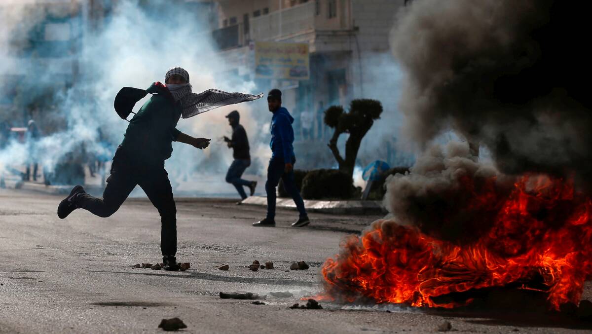 Palestinian demonstrators burn tyres and throw rocks in the West Bank in 2021. Picture Shutterstock