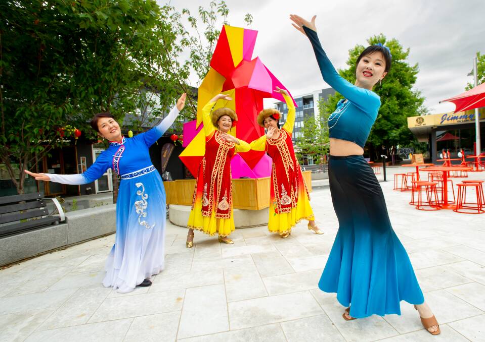 Dancers Jing Zhang, Ru Xian, Qingping Ma and Cindy Sheng get ready for Lunar New Year celebrations. Picture by Elesa Kurtz