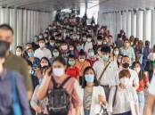 A crowd of people in Bangkok at the outbreak of the COVID-19 pandemic. Picture Shutterstock