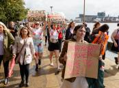 Protesters march against gender-based violence in Newcastle. Picture by Max Mason-Hubers